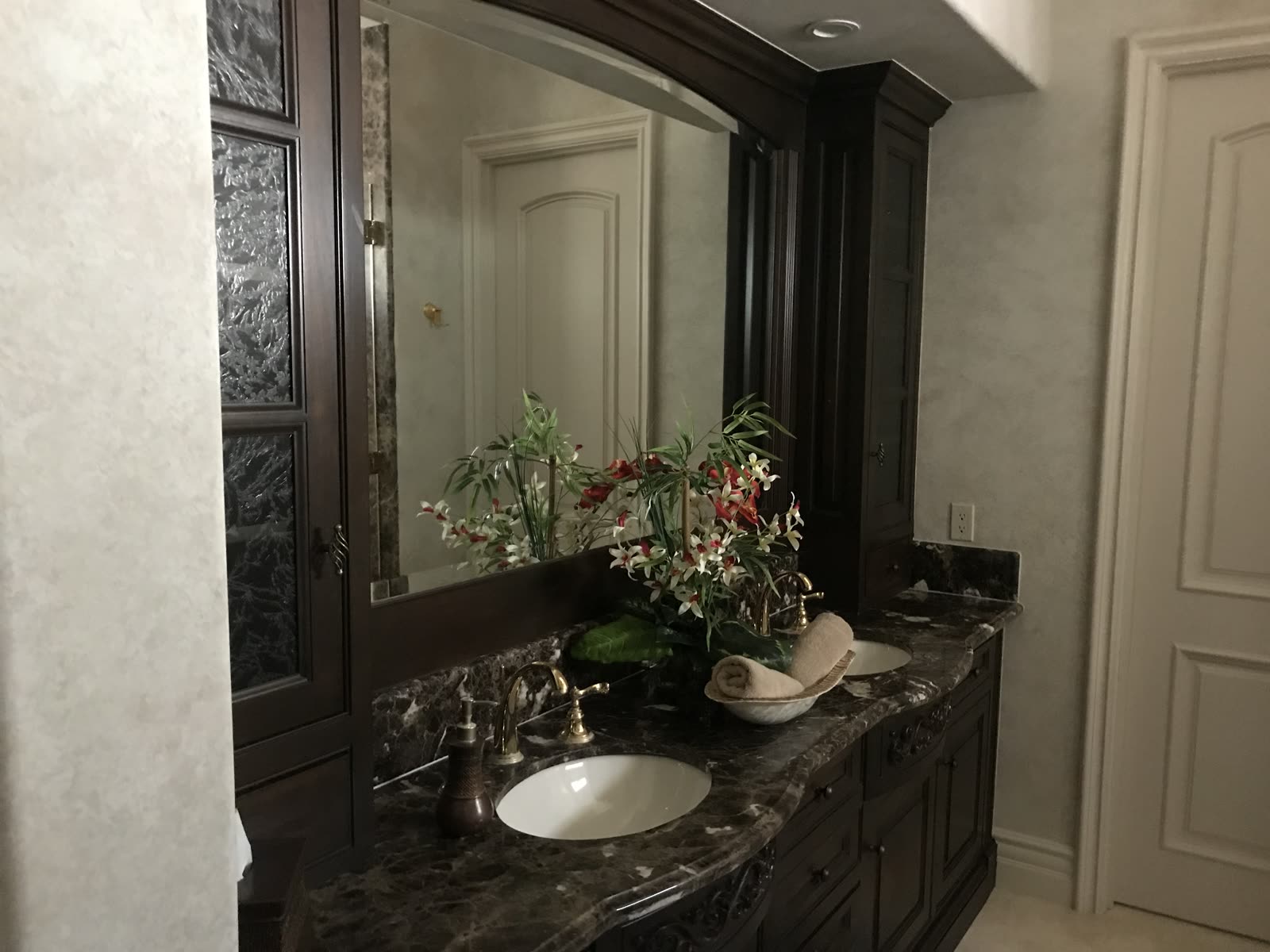 Master bath vanity in dark marble with custom cabinetry