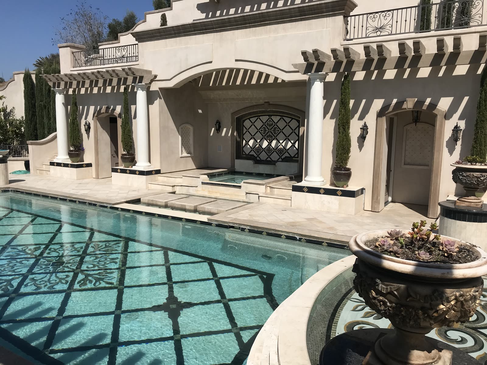 Sunken spa with mosaic medallion