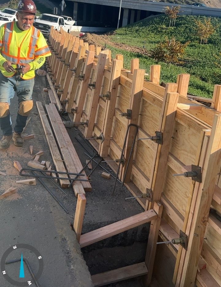 Storm drain pipe installation in a shored trench